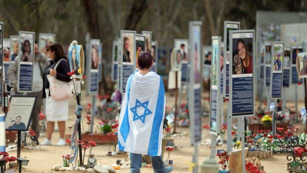 People visit the Nova music festival victims' memorial in Israel