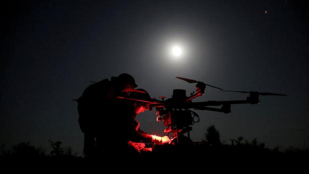 FILE PHOTO: Ukrainian servicemen prepare a heavy combat drone before flying it over positions of Russian troops near the frontline town of Chasiv Yar