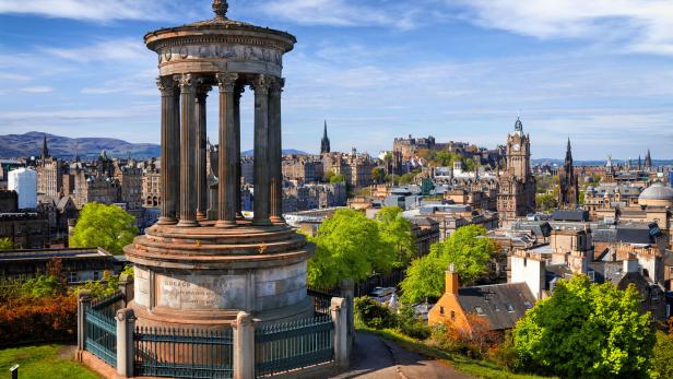 Dugald Stewart Monument and view over historic Edinburgh from Calton Hill, Scotland, UK