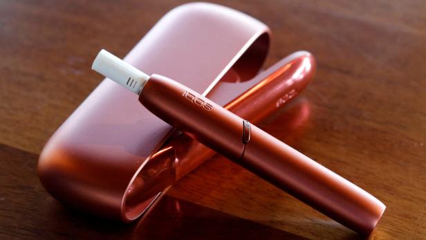 FILE PHOTO: Electric tobacco heating system IQOS of cigarette maker Philip Morris Switzerland is displayed after a news conference in Bern
