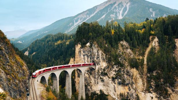 Scenic Train Journey Through Mountains in Switzerland