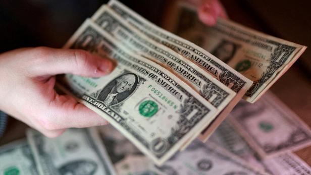 FILE PHOTO: Illustration shows U.S. dollar banknotes