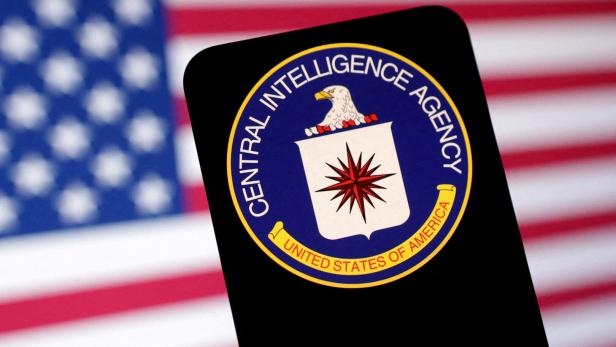 FILE PHOTO: Illustration shows CIA (Central Intelligence Agency) logo and U.S. flag