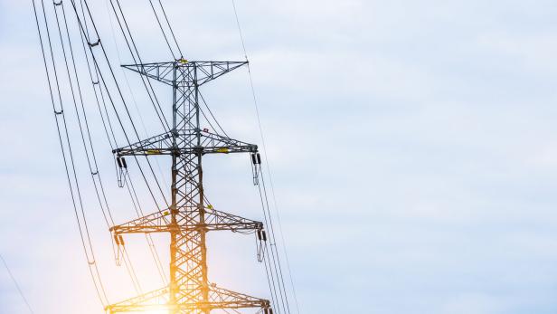 Electricity concept. Close up high voltage power lines station.