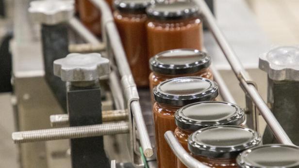 Glass jars with different kinds of jam