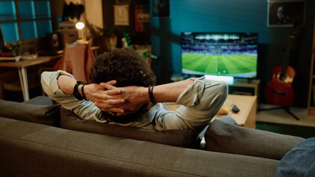 Unrecognizable Man Relaxing In Evening