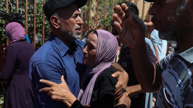 Palestinians mourn loved ones at Nasser hospital following an Israeli strike, in Khan Younis