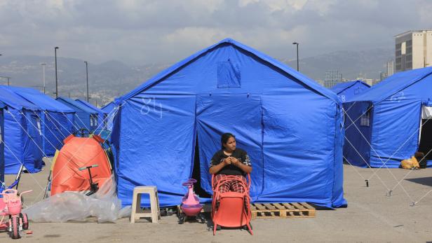People set up tents at the Beirut waterfront, in Beirut