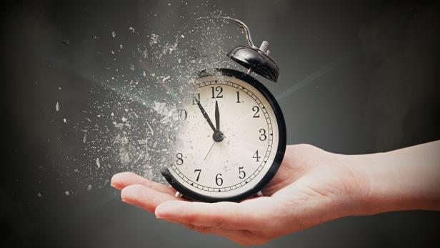 Concept of passing away, the clock breaks down into pieces