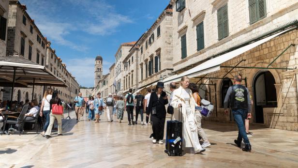 Tourists walk in the Old Town in Dubrovnik