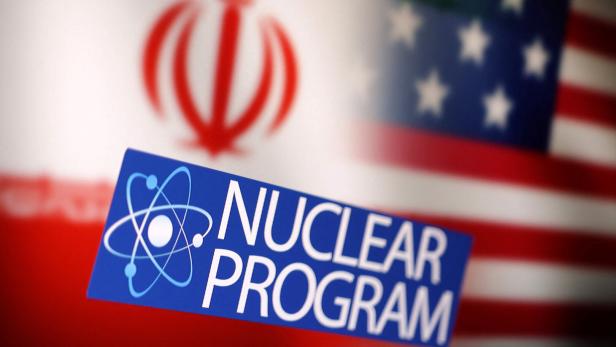 Illustration shows Iran and U.S. flags, atom symbol and words "Nuclear program\