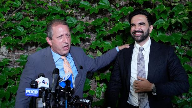 Brad Lander, candidate for New Yorks 10th Congressional District, speaks to the media while standing next to New York City Mayor Zohran Mamdani during a watch party after winning the primary elections in Brooklyn, New York