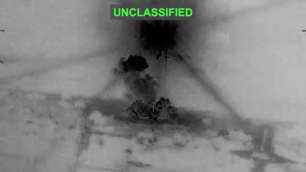 Smoke rises from explosions at an unknown location, following what U.S. Central Command (CENTCOM) said were strikes on Iran in response to an Iranian drone strike on a cargo ship in the Strait of Hormuz