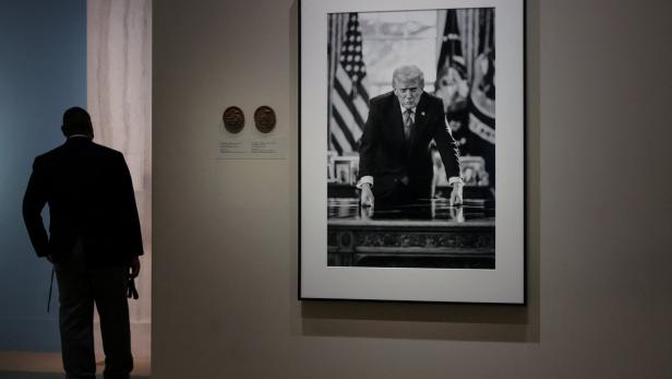People view the portrait of U.S. President Donald Trump at the Smithsonian National Portrait Gallery in Washington