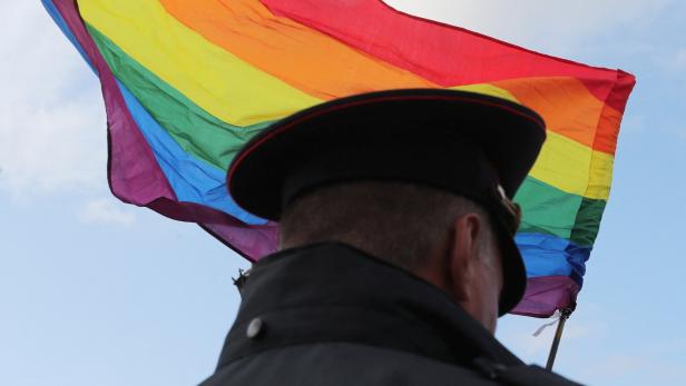 FILE PHOTO: A law enforcement officer stands guard during the LGBT community rally "X St.Petersburg Pride" in Saint Petersburg