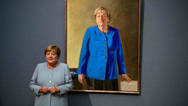 GERMANY-POLITICS-ART-PAINTING-MERKEL