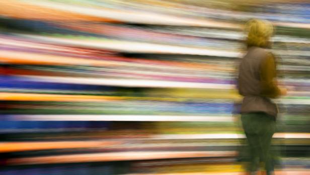 Female Customer Walking Against Colorful Background, Blurred Motion