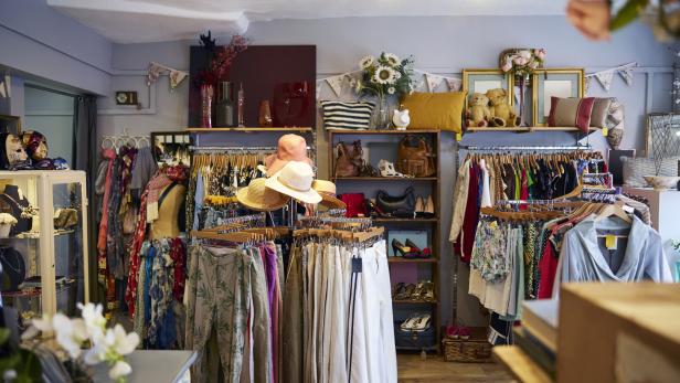 Interior Of Charity Shop Or Thrift Store Selling Used And Sustainable Clothing And Household Goods