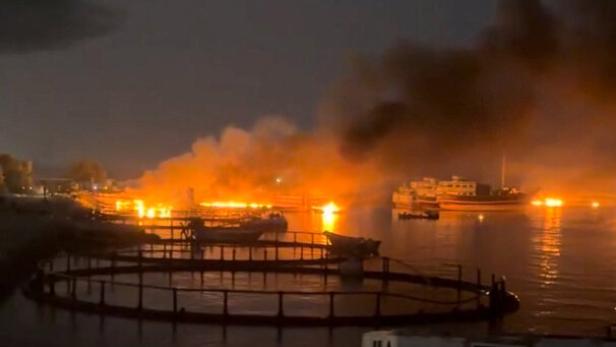 Smoke rises from a port following a U.S. strike in Kuhestak