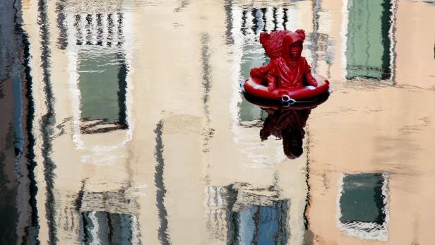 James Colominas unauthorized artwork "Nothing Serious"  floats on the Rio di San Felice in Venice