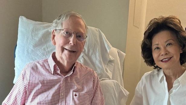 U.S. Senator Mitch McConnell (R-KY) sits with his wife in photo released July 12