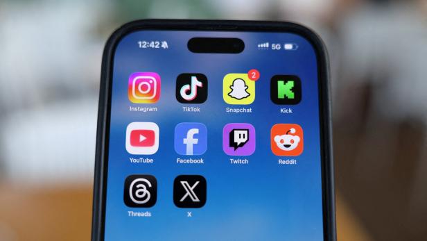 FILE PHOTO: Social media apps are displayed on a mobile phone