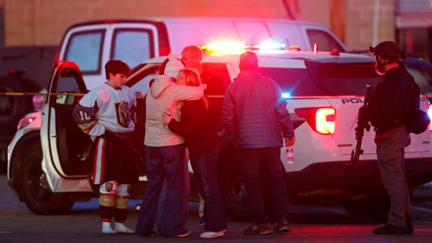 Police and emergency vehicles are seen outside the Dennis M Lynch Arena, an indoor ice skating rink, after a shooting in Pawtucket
