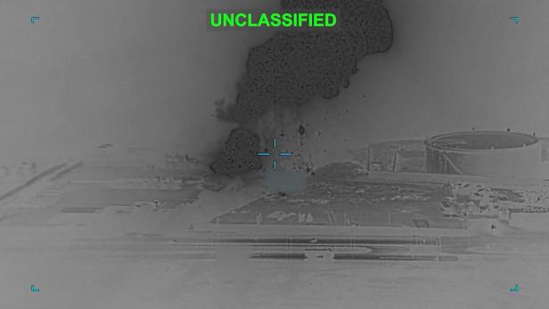 Smoke rises following a strike at an unknown location during what the U.S. military says is its latest wave of strikes on Iran