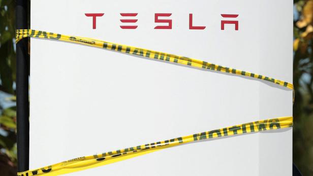 Tesla Supercharger stations, yet to be opened and cordoned off with yellow tape, in Pasadena