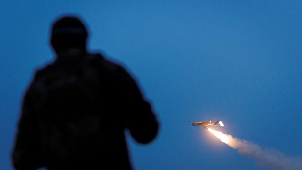 Ukrainian serviceman looks at an FP-1 deep-strike drone as it launches for a combat mission in an undisclosed location in Ukraine