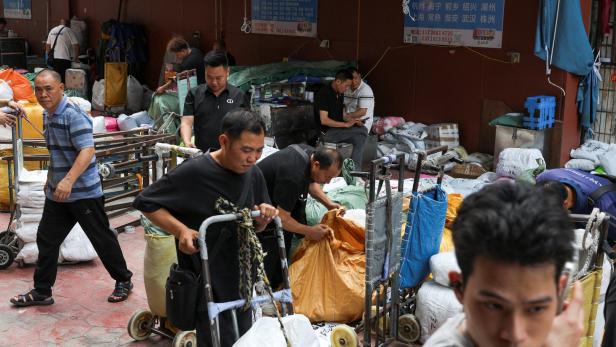 FILE PHOTO: Logistics companies at a clothing wholesale district in Guangzhou