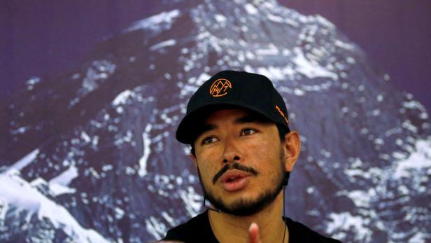 Nirmal Purja, attempting a record to climb fourteen 8000-meter mountain peaks in seven months speaks during a news conference after climbing six mountains including Mt. Everest in Kathmandu