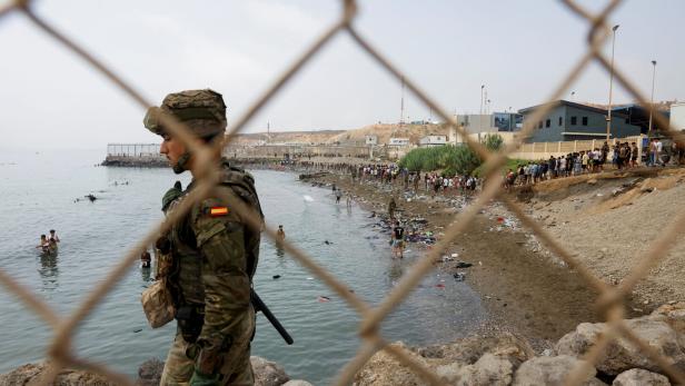 Migrants cross into the Spanish enclave of Ceuta
