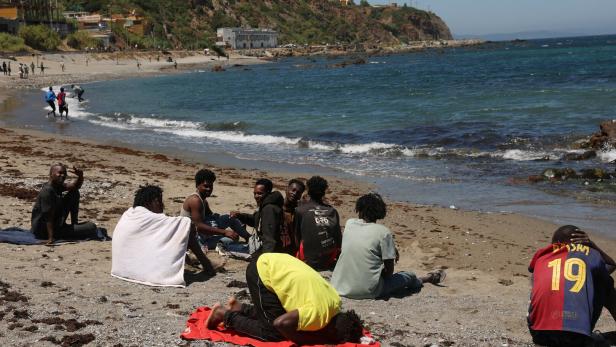 Mass crossings of migrants on foot and by sea from Morocco into Spanish territory, in Ceuta