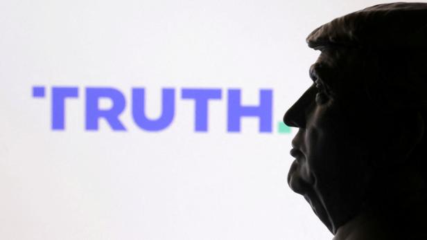 FILE PHOTO: Illustration shows 3D printed miniature of U.S. president Donald Trump and Truth social logo