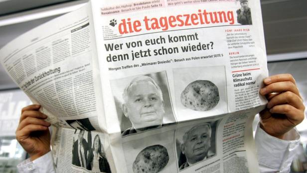 epa00877804 A woman reads an issue of the German daily newspaper &#039;taz&#039; which refers to a meeting of the &#039;Weimar Triangle&#039; on its frontpage in Berlin, Monday 04 December 2006. The front page shows a photo of the Polish President Lech Kaczynski and a potatoe under the headline &#039;Who of you is coming again now&#039;. German Chancellor Angela Merkel, French President Chirac and Poland&#039;s President Kaczynski make up for their meeting cancelled on short-notice in June in the course of the &#039;Weimar Triangle&#039;. The official cause had been an illness of the Polish head of state, but according to speculations in Poland Kaczynski had been annoyed about a media satire launched at him in Germany. EPA/Gero Breloer