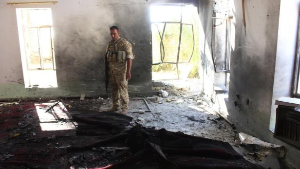 An Iraqi soldier inspects a Sunni mosque at the site of a suicide bomber attack in the town of Wajihiya in the ethnically and religiously diverse province of Diyala, July 20, 2013. A suicide bomber blew himself up inside a Sunni mosque in central Iraq, killing at least 20 people in the middle of a sermon on Friday. REUTERS Mohammed Adnan (IRAQ - Tags: CIVIL UNREST POLITICS TPX IMAGES OF THE DAY)