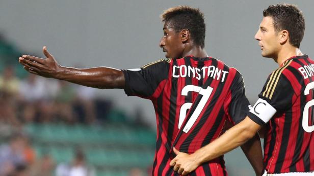 epa03798943 AC Milan&#039;s French midfielder Kevin Constant (L), protests held by teammate Daniele Bonera during the Trofeo Tim against Sassuolo to Mapei stadium in Reggio Emilia, Italy, 23 July 2013. Constant left the field around the half-hour of the game in protest of some alleged racist chanting that had been directed at him in the stadium. At first it seemed that the player was sent off, but the referee Gervasoni has made it clear that he was out on his own.The TIM trophy is a yearly soccer pre-season tournament played by 3 Italian Serie A soccer teams: Juventus FC, AC Milan and Sassuolo Calcio. EPA/ELISABETTA BARACCHI