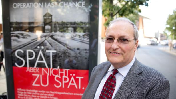 epa03798087 Efraim Zuroff, the director of the Simon Wiesenthal Centre in Jerusalem, stands in front of a poster at the start of the poster campaign &#039;Late. But not too late! Operation Last Chance II&#039;, in Berlin, Germany, 23 July 2013. The campaign aims to find non-sentenced Nazi war criminals with help from the public and to bring them for trial in court. EPA/JOERG CARSTENSEN