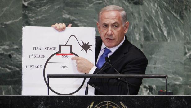 Israel&#039;s Prime Minister Benjamin Netanyahu points to a red line he has drawn on a graphic of a bomb used to represent Iran&#039;s nuclear programme as he addresses the 67th United Nations General Assembly at the U.N. Headquarters in New York in this September 27, 2012 file photo. The red line he drew represents a point where he believes, the international community should tell Iran that they will not be allowed to pass without intervention. To match Special Report IRAN-SANCTIONS/ REUTERS/Lucas Jackson/Files (UNITED STATES - Tags: POLITICS)