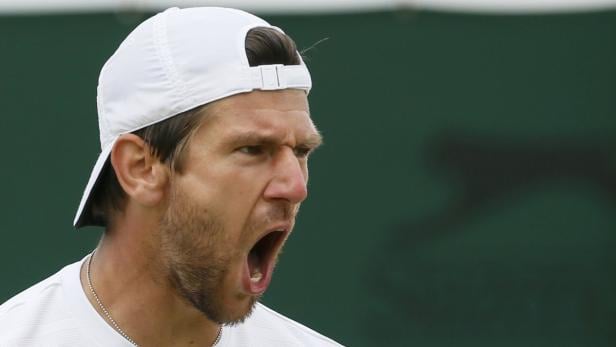 Jurgen Melzer of Austria reacts during his men&#039;s singles tennis match against Jerzy Janowicz of Poland at the Wimbledon Tennis Championships, in London July 1, 2013. REUTERS/Stefan Wermuth (BRITAIN - Tags: SPORT TENNIS)