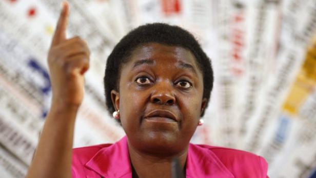 Italian Minister for Integration Cecile Kyenge gestures during a news conference in Rome in this June 19, 2013 file photo. A senior parliamentarian in the anti-immigration Northern League party has likened Italy&#039;s first black minister to an orangutan. Kyenge, an Italian citizen born in the Democratic Republic of Congo, has been the target of repeated racial slurs since her appointment as integration minister in April. Roberto Calderoli, vice president of Italy&#039;s Senate, said on July 13, 2013 at a political rally in the northern town of Treviglio, &quot;I love animals - bears and wolves, as everyone knows - but when I see the pictures of Kyenge I cannot but think of, even if I&#039;m not saying she is one, the features of an orangutan.&quot; REUTERS/Tony Gentile/Files (ITALY - Tags: POLITICS SOCIETY IMMIGRATION)