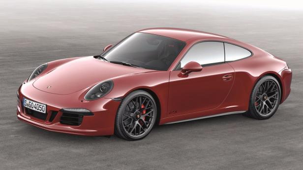 Ein roter Porsche 911 GTS steht auf einer grauen Oberfläche.