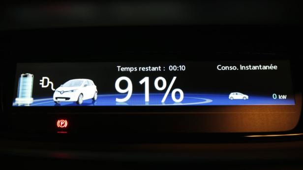 A screen displays the remaining charging time of a