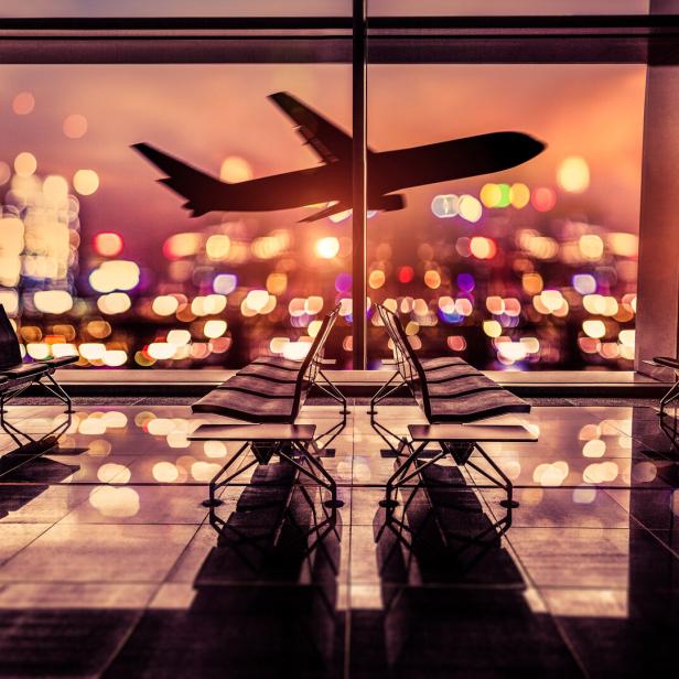 Airport Lounge and airplane take off in the city