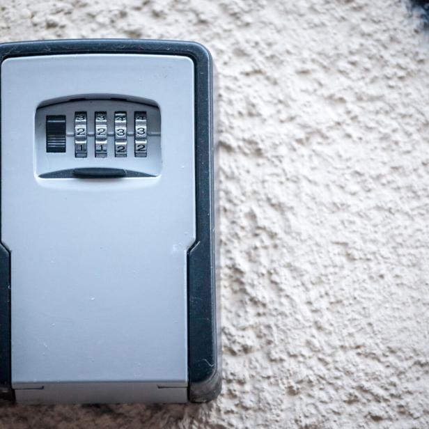 Lockbox, also called keysafe, or key safe, in front of the entrance door of a short term vacation rental, made at delivering keys to guests without contacts.