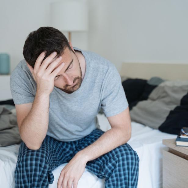 Man with sleeping problem wake up feeling tiredness