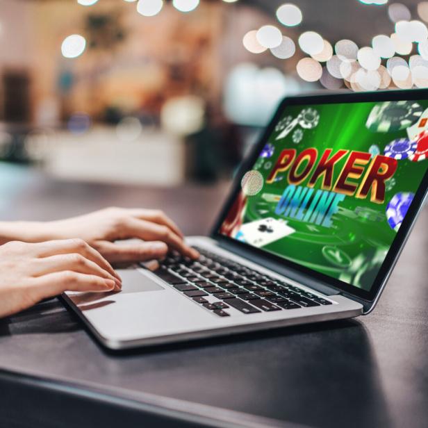 Girl using her laptop for playing poker online