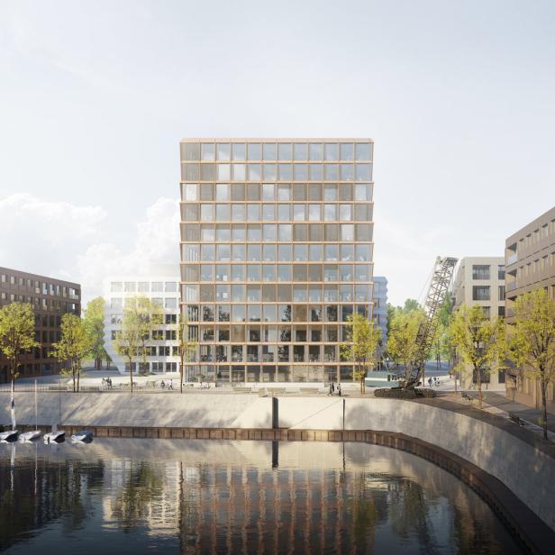 Ein modernes Bürogebäude mit Glasfassade am Ufer eines Flusses.
