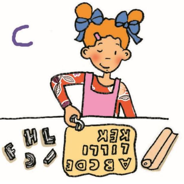 Ein Mädchen sticht Buchstaben aus einem Teig aus.